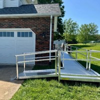 aluminum wheelchair ramp installed from driveway to backyard entry by Lifeway Mobility
